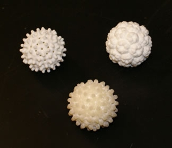 Three-dimensional printed objects, two made using a proprietary plastic called "Elasto Plastic", and one using a harder plastic called "Strong and Flexible".